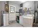Well-equipped laundry room featuring a washer, dryer, and ample storage space at 2811 S Peninsula Dr, Daytona Beach, FL 32118