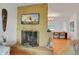 Inviting living room featuring a decorative fireplace with a stone surround and an open layout at 2811 S Peninsula Dr, Daytona Beach, FL 32118