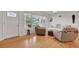 Bright living room with hardwood floors, comfortable seating, and large windows for natural light at 2811 S Peninsula Dr, Daytona Beach, FL 32118