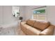 Cozy sitting area with sleek floors, a comfortable couch, and natural light filtering through the windows at 2811 S Peninsula Dr, Daytona Beach, FL 32118