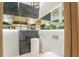 Modern powder room featuring a pedestal sink, unique lighting, and decorative tile accents at 2942 Wordsmith Rd, Kissimmee, FL 34746