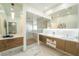 Modern bathroom features a glass-enclosed shower, dual vanities, and stylish fixtures at 2942 Wordsmith Rd, Kissimmee, FL 34746