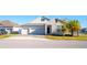 Charming two-story home with a two car garage, stone accents, and a well maintained lawn at 2942 Wordsmith Rd, Kissimmee, FL 34746