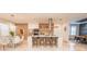 Modern kitchen with a central island, stainless steel appliances, and stylish barstool seating at 2942 Wordsmith Rd, Kissimmee, FL 34746
