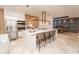 Elegant kitchen featuring stainless steel appliances, a spacious island, and a modern design at 2942 Wordsmith Rd, Kissimmee, FL 34746