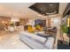 Spacious living room with modern decor, connecting dining and kitchen areas, perfect for entertaining at 2942 Wordsmith Rd, Kissimmee, FL 34746