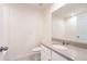 Bathroom features a single vanity, a toilet, and a mirror at 2962 Firebush Way, Clermont, FL 34711