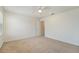 Bright bedroom with plush carpet and a ceiling fan with access to the bathroom at 2962 Firebush Way, Clermont, FL 34711