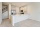 Kitchen with stainless steel appliances, quartz countertops, and wood-look tile flooring at 2962 Firebush Way, Clermont, FL 34711