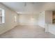 Spacious and open living area with wood-look tile flooring, recessed lighting, and a ceiling fan at 2962 Firebush Way, Clermont, FL 34711