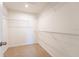 Walk-in closet featuring wire shelving and carpeted floor at 2962 Firebush Way, Clermont, FL 34711