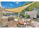 Inviting backyard patio with comfortable seating, sunshade, and barbecue area, creating an outdoor oasis at 3000 Amherst Ave, Orlando, FL 32804