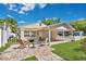 Cozy backyard patio with outdoor seating, grill, and shaded sun sail, perfect for relaxing and entertaining at 3000 Amherst Ave, Orlando, FL 32804