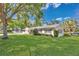 Well-maintained home with a lush green lawn and beautiful landscaping, showcasing its inviting exterior at 3000 Amherst Ave, Orlando, FL 32804