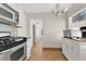 Spacious kitchen with modern appliances, ample countertop space, and stylish white cabinetry at 3000 Amherst Ave, Orlando, FL 32804