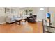 Bright living room with hardwood floors, stylish furniture, and a large window offering ample natural light at 3000 Amherst Ave, Orlando, FL 32804