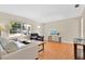 Bright and airy living room showcasing hardwood floors, modern furnishings, and a cozy atmosphere at 3000 Amherst Ave, Orlando, FL 32804