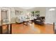Comfortable living room featuring hardwood floors, neutral-toned furniture, and abundant natural light at 3000 Amherst Ave, Orlando, FL 32804