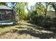 Spacious backyard with tropical landscaping provides a lush and private outdoor space at 308 Tangerine St, Altamonte Springs, FL 32701