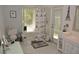 Bright bathroom with Eiffel Tower accents, shower-tub combo, and ample natural light at 308 Tangerine St, Altamonte Springs, FL 32701