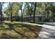 Charming single-story home with well-maintained landscaping, mature trees, and an inviting driveway at 308 Tangerine St, Altamonte Springs, FL 32701
