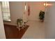 Bright foyer with tiled flooring, a decorative chair, and a view of the front door at 308 Tangerine St, Altamonte Springs, FL 32701