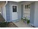 Inviting front porch with charming decor, including a bench, welcome sign, and seasonal accents at 308 Tangerine St, Altamonte Springs, FL 32701