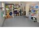Tidy garage with shelves and organized storage, painted floor at 308 Tangerine St, Altamonte Springs, FL 32701
