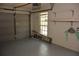 Garage interior with a garage door, epoxy flooring and window at 308 Tangerine St, Altamonte Springs, FL 32701