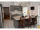 Modern kitchen with gray cabinets, stainless appliances, breakfast bar, and an open layout at 308 Tangerine St, Altamonte Springs, FL 32701