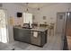 A spacious kitchen with a large island, modern fixtures, and stainless steel appliances at 308 Tangerine St, Altamonte Springs, FL 32701