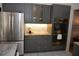 This well-equipped kitchen includes stainless steel appliances and gray cabinets at 308 Tangerine St, Altamonte Springs, FL 32701