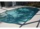 Clear blue in ground pool with a pool cleaning robot at 308 Tangerine St, Altamonte Springs, FL 32701