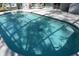 Swimming pool with a pool cleaning robot, under a screened in lanai at 308 Tangerine St, Altamonte Springs, FL 32701