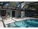 Screened in pool with patio furniture and a view of the backyard at 308 Tangerine St, Altamonte Springs, FL 32701