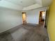 Bedroom with neutral carpet, natural light, and access to an ensuite bathroom at 3665 Brighton Park Cir, Orlando, FL 32812