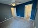 Bedroom with doors to closet and adjacent room at 3665 Brighton Park Cir, Orlando, FL 32812