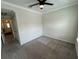 Bedroom with ceiling fan and door to hallway at 3665 Brighton Park Cir, Orlando, FL 32812