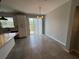 Bright dining area with tile flooring and sliding glass doors leading to the outdoors at 3665 Brighton Park Cir, Orlando, FL 32812
