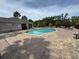 Community pool features lounge chairs, picnic tables and palm trees at 3665 Brighton Park Cir, Orlando, FL 32812