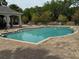 Well-maintained community pool with lounge chairs and a spacious deck at 3665 Brighton Park Cir, Orlando, FL 32812