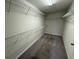 Walk-in closet featuring shelving and carpet flooring at 3665 Brighton Park Cir, Orlando, FL 32812