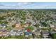 Aerial view of a quiet neighborhood with homes, showcasing tree coverage and local street layout at 3840 Cedarwaxwing Ave, Orlando, FL 32822