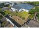 Spacious backyard with green grass, mature trees, landscaping, and a privacy fence at 3840 Cedarwaxwing Ave, Orlando, FL 32822
