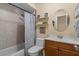 Cozy bathroom with a shower-tub combo, updated fixtures, and a vanity with storage at 3840 Cedarwaxwing Ave, Orlando, FL 32822