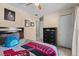 Cozy bedroom featuring a ceiling fan, comfortable bed, and neutral color palette at 3840 Cedarwaxwing Ave, Orlando, FL 32822