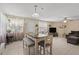 Bright and airy dining area with bench seating, stylish furniture, and neutral decor at 3840 Cedarwaxwing Ave, Orlando, FL 32822