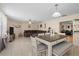 Open concept living and dining area with stylish furnishings, neutral colors, and ample natural light at 3840 Cedarwaxwing Ave, Orlando, FL 32822