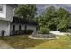 Serene backyard featuring a stone garden with mature greenery and a well-kept lawn at 4174 Fallwood Cir, Orlando, FL 32812
