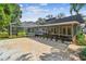 Backyard view with a pool, patio, and lovely landscaping, perfect for outdoor gatherings and relaxing at 4174 Fallwood Cir, Orlando, FL 32812